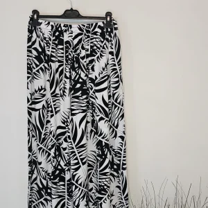 AVP PASSION Pantalon fluide femme bohème taille basse à motifs feuilles noir blanc